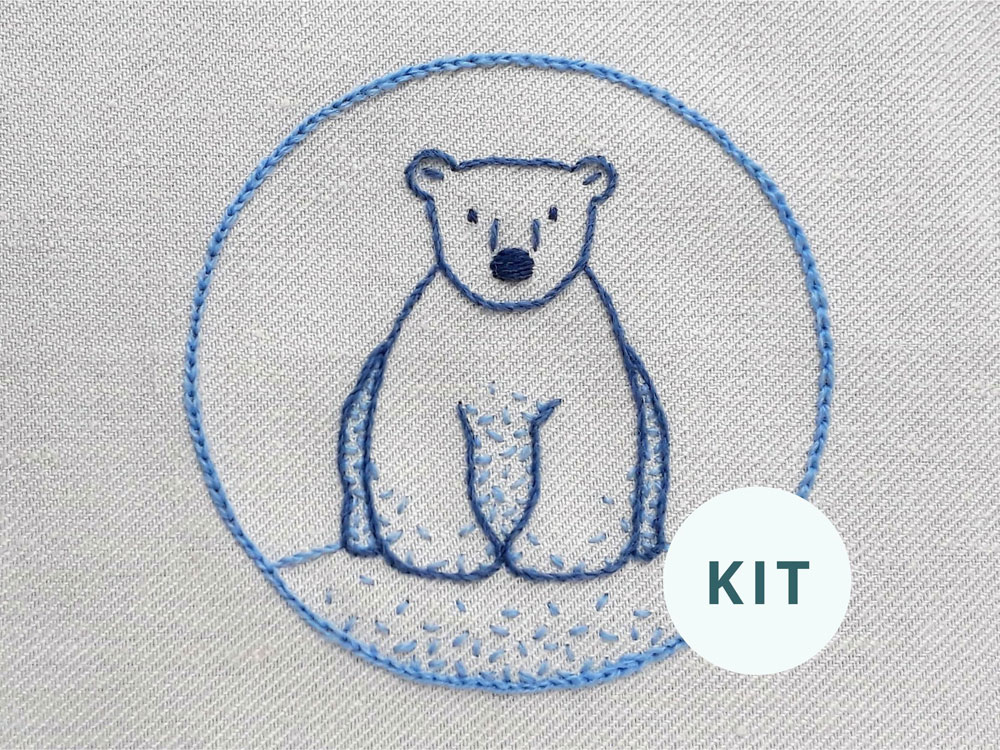 Image of the completed cute polar bear crewel embroidery kit.