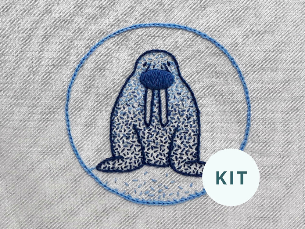Image of the completed cute walrus crewel embroidery kit.