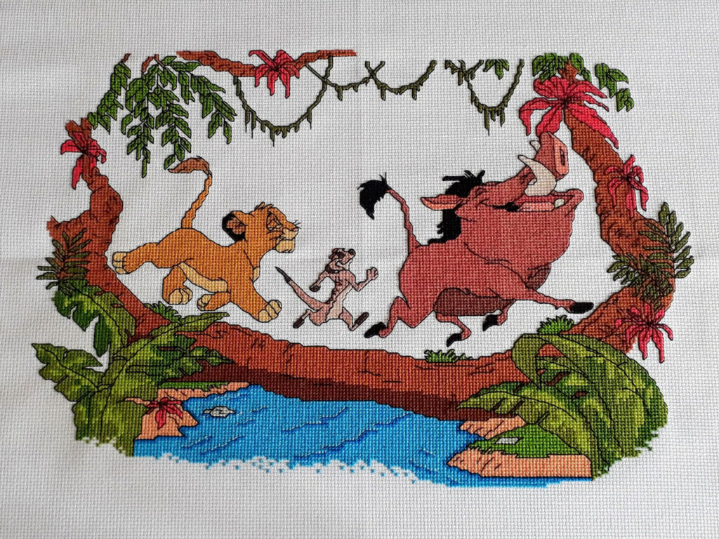 Cross stitch of a scene from the Lion King.