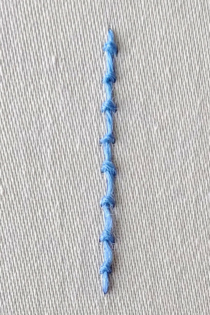 Straight line of coral stitch.