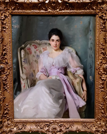 Painting of a seated white woman wearing a white dress with a lilac sash around her waist.